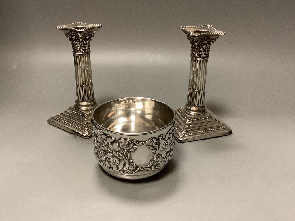 A foliate-cast circular silver bowl, Walker & Hall, Sheffield 1901 and a pair of silver Corinthian column dwarf candlesticks 8.25oz (weighable)